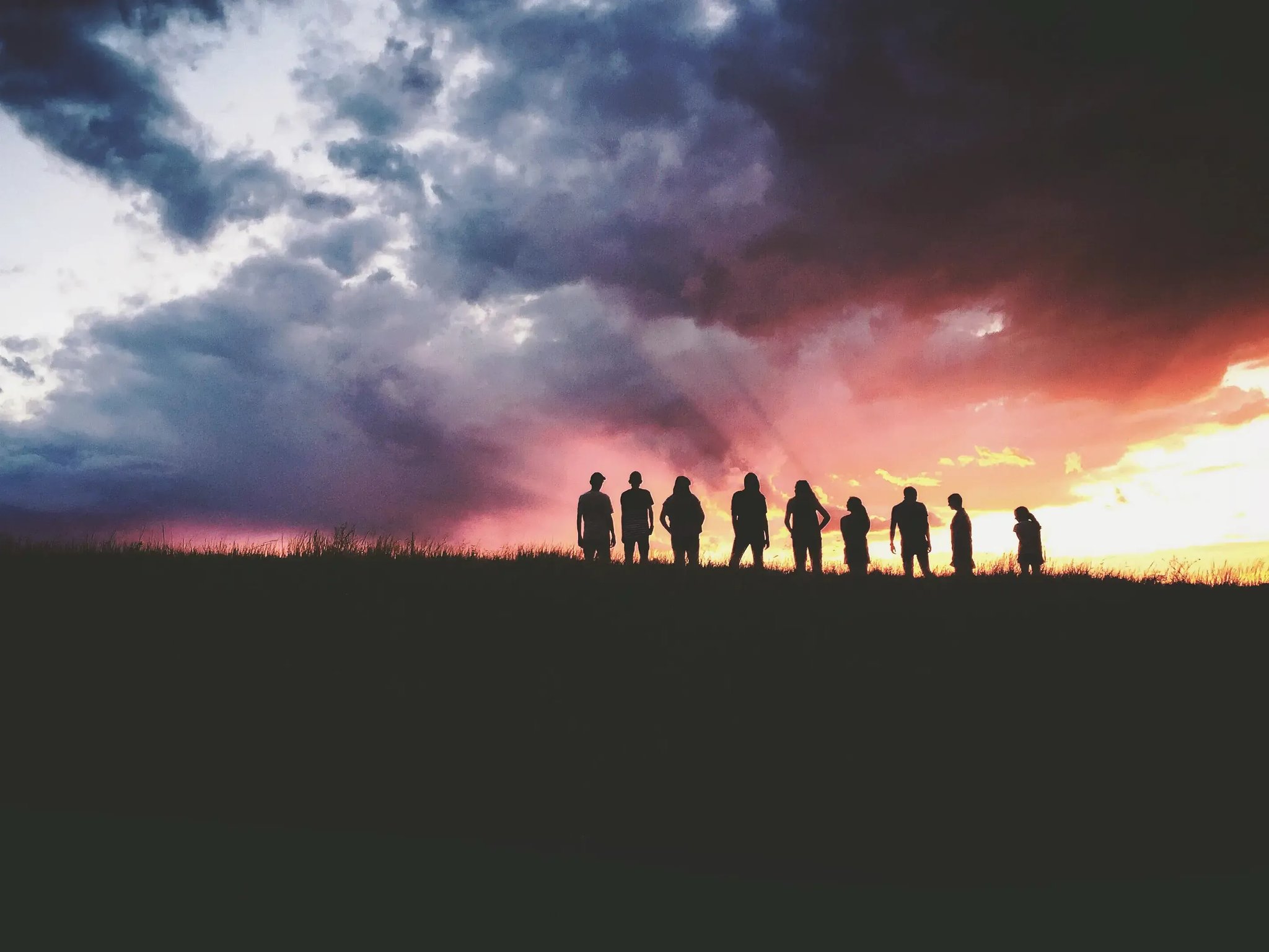 Silhouette of young people in the sunset
